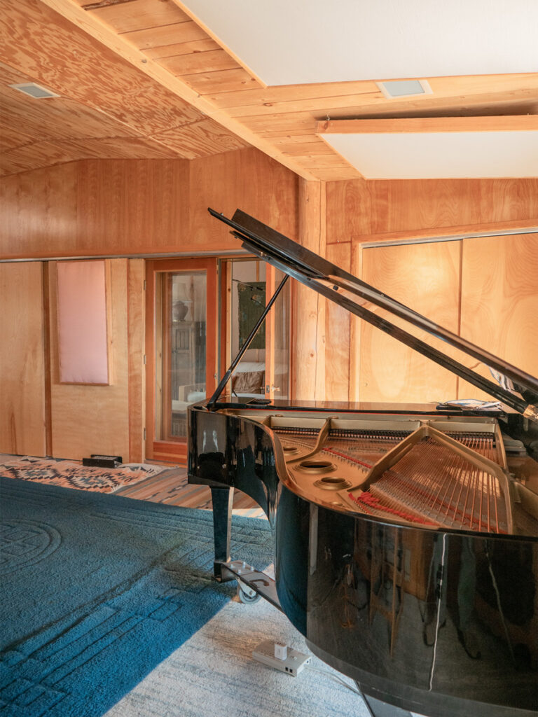 Main recording room with Yamaha C7 grand piano, view into side room at Desert Heart Studio